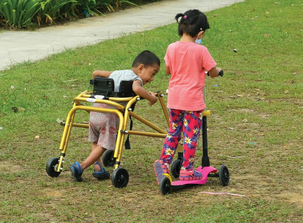 Child with mobility aids